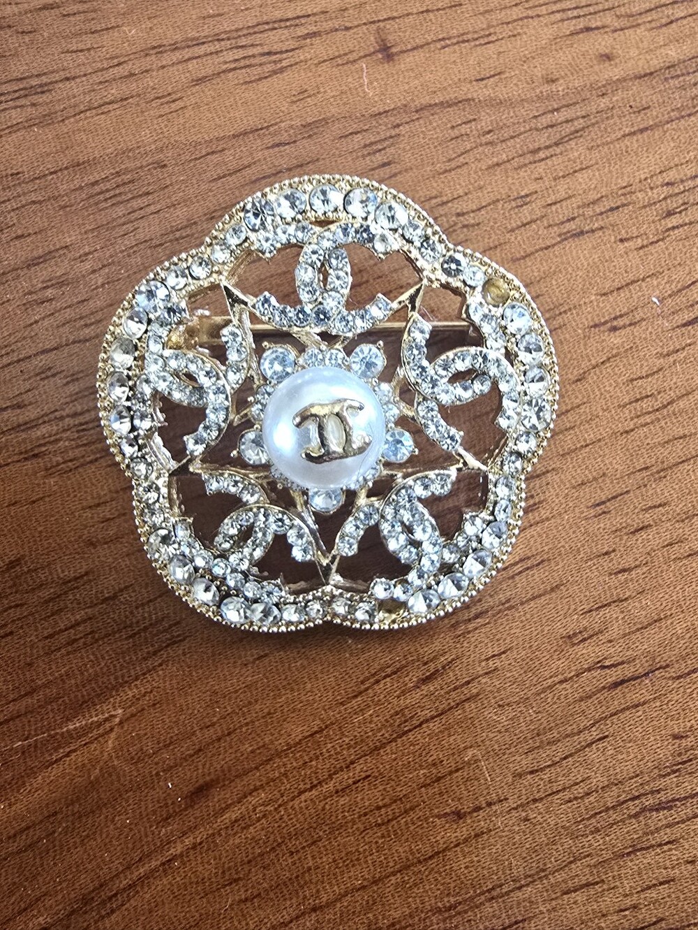 Vintage CHANEL Gold-Tone Crystal Floral Brooch with Pearl Center